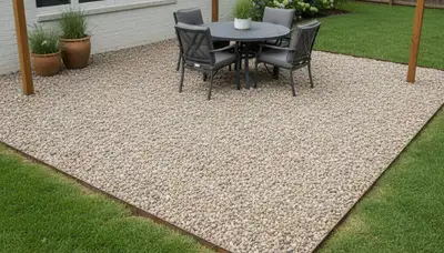 Pea gravel patio with edging and furniture in Nashville, TN by Chop Chop Landscaping